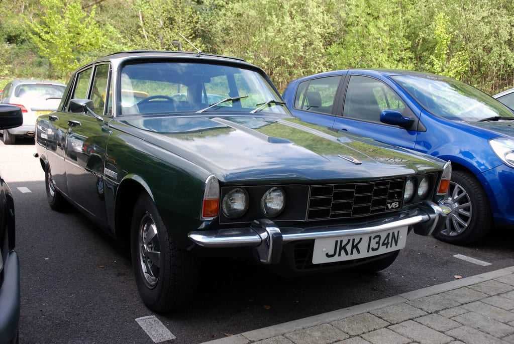 A dark green Rover P6 3500 V8 parked on tarmac, front three-quarter view, UK registration JKK 134N