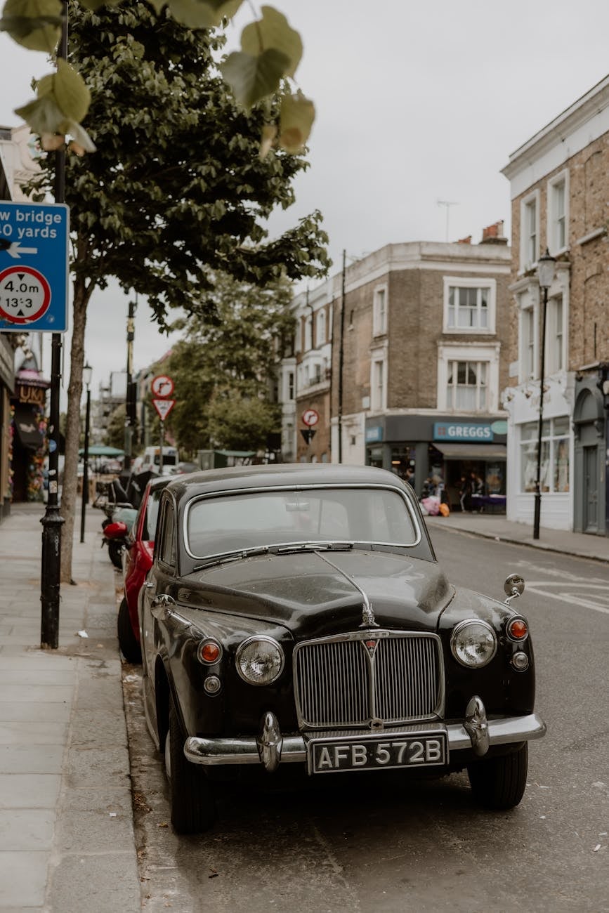 A black Rover P4 saloon parked on a London street