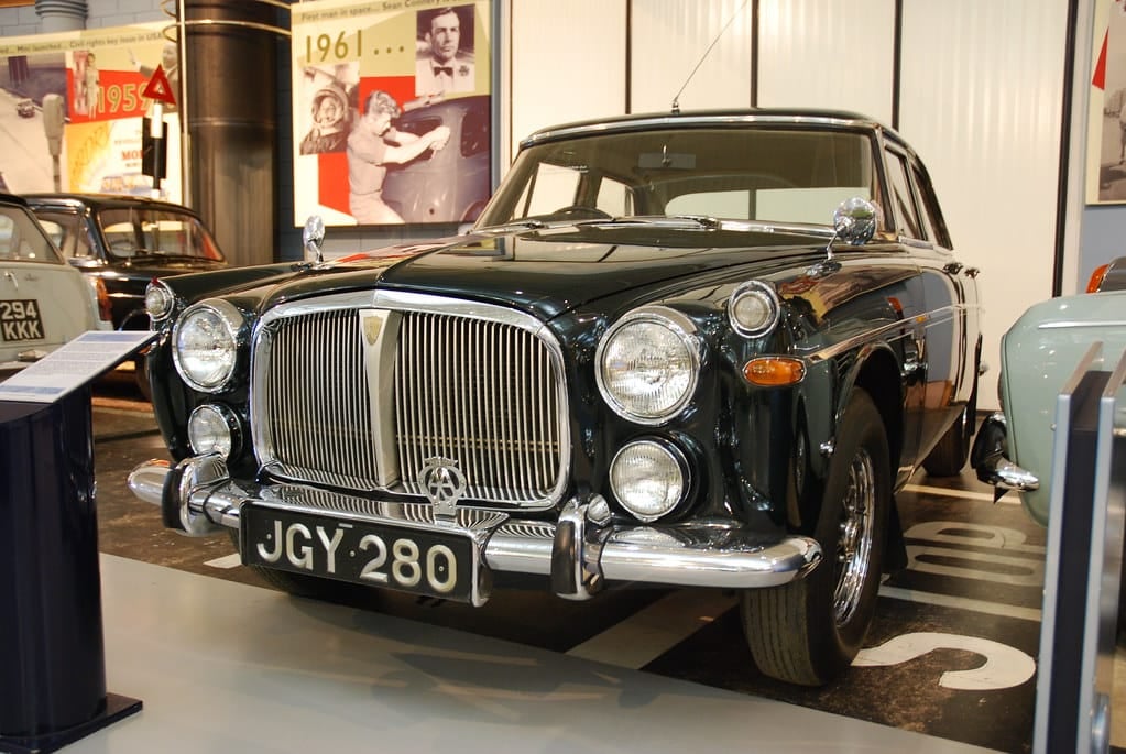 A dark green Rover P5 3-Litre displayed in a motor museum, UK registration JGY 280