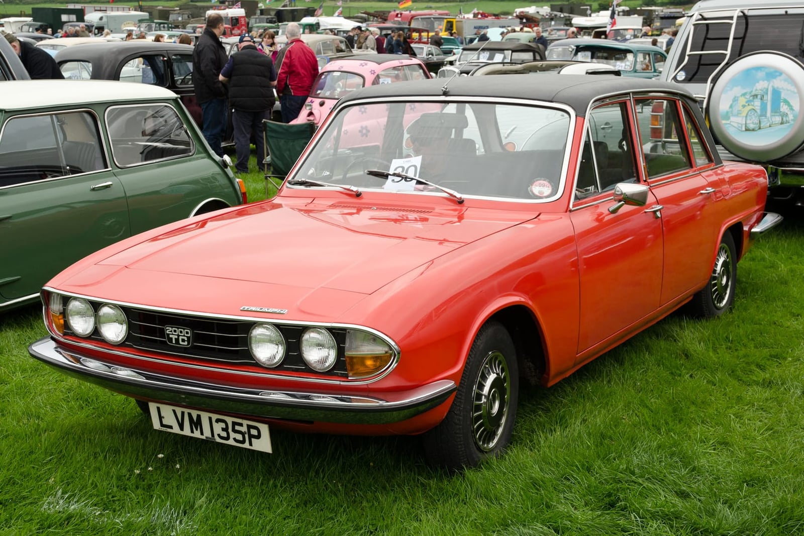 A red 1976 Triumph 2000 TC Mk2 with UK registration LVM 135P at a classic car show