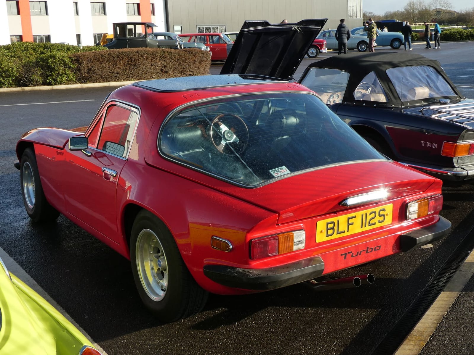 A red 1978 TVR Taimar Turbo rear three-quarter view with UK registration BLF 112S