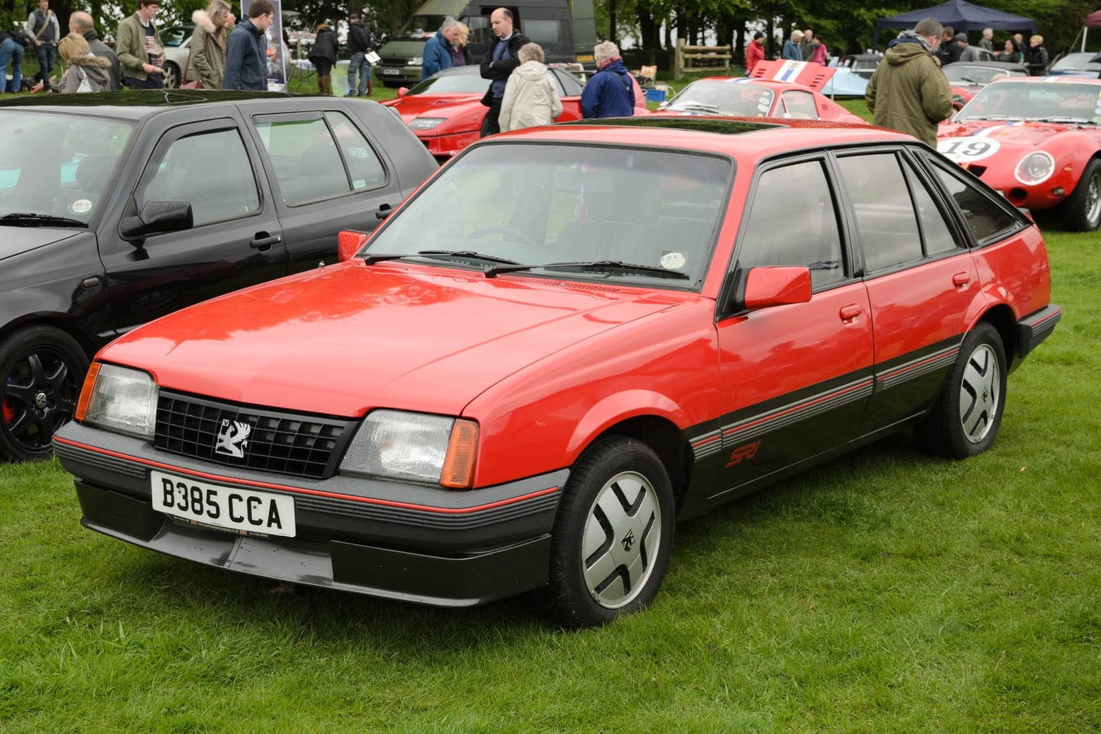 A red 1985 Vauxhall Cavalier SRi hatchback with UK registration B385 CCA