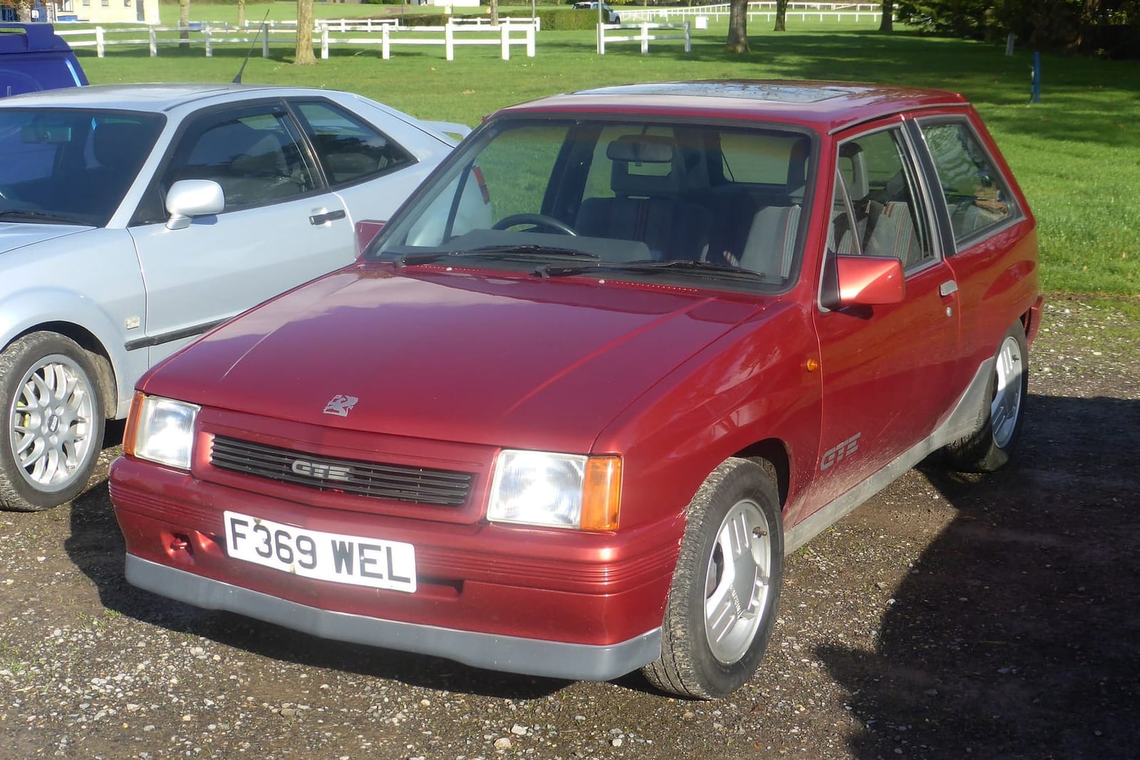 A red 1989 Vauxhall Nova GTE with UK registration F369 WEL