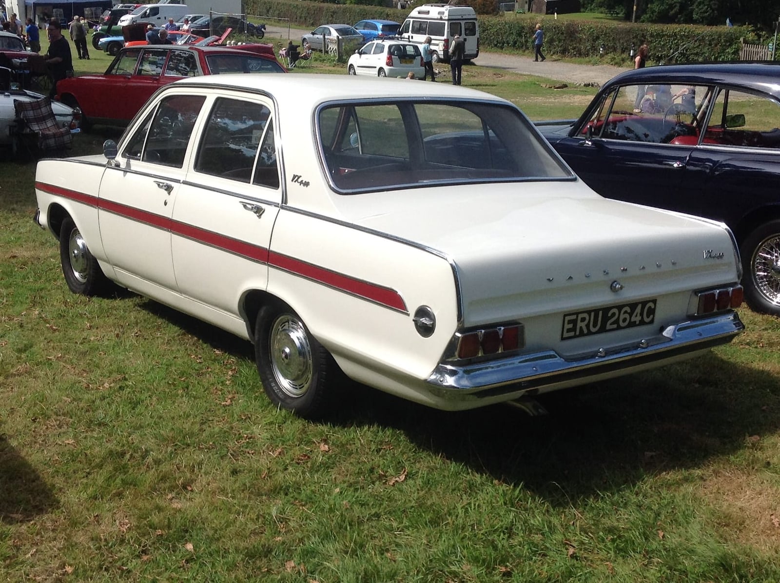A white Vauxhall VX4/90 FC with a red side flash on grass at a classic car show, side view, UK registration ERU 264C