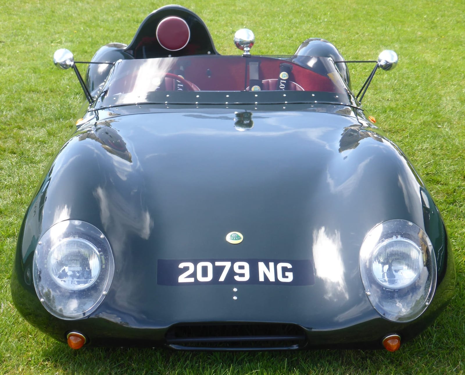 A green Westfield XI, a modern Lotus Eleven replica, on grass, front view, UK registration 2079 NG