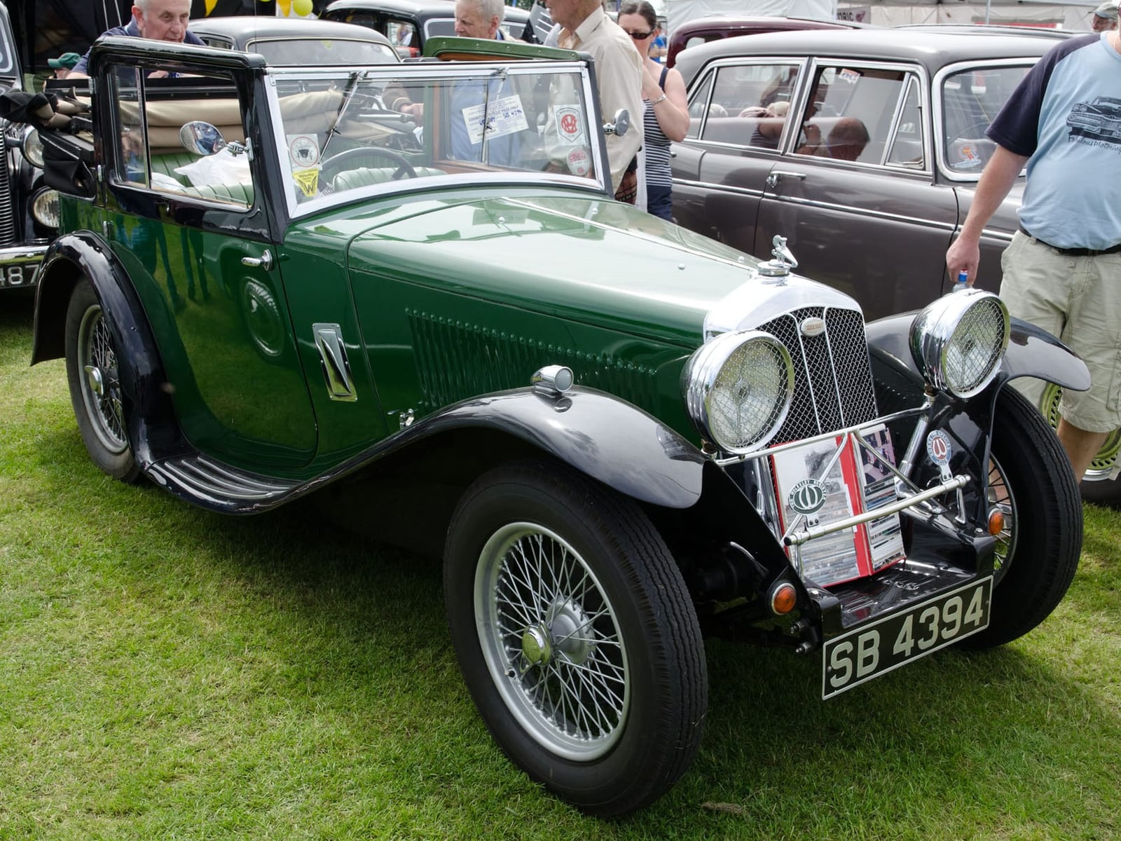 A green 1934 Wolseley Hornet Special sports car with wire wheels