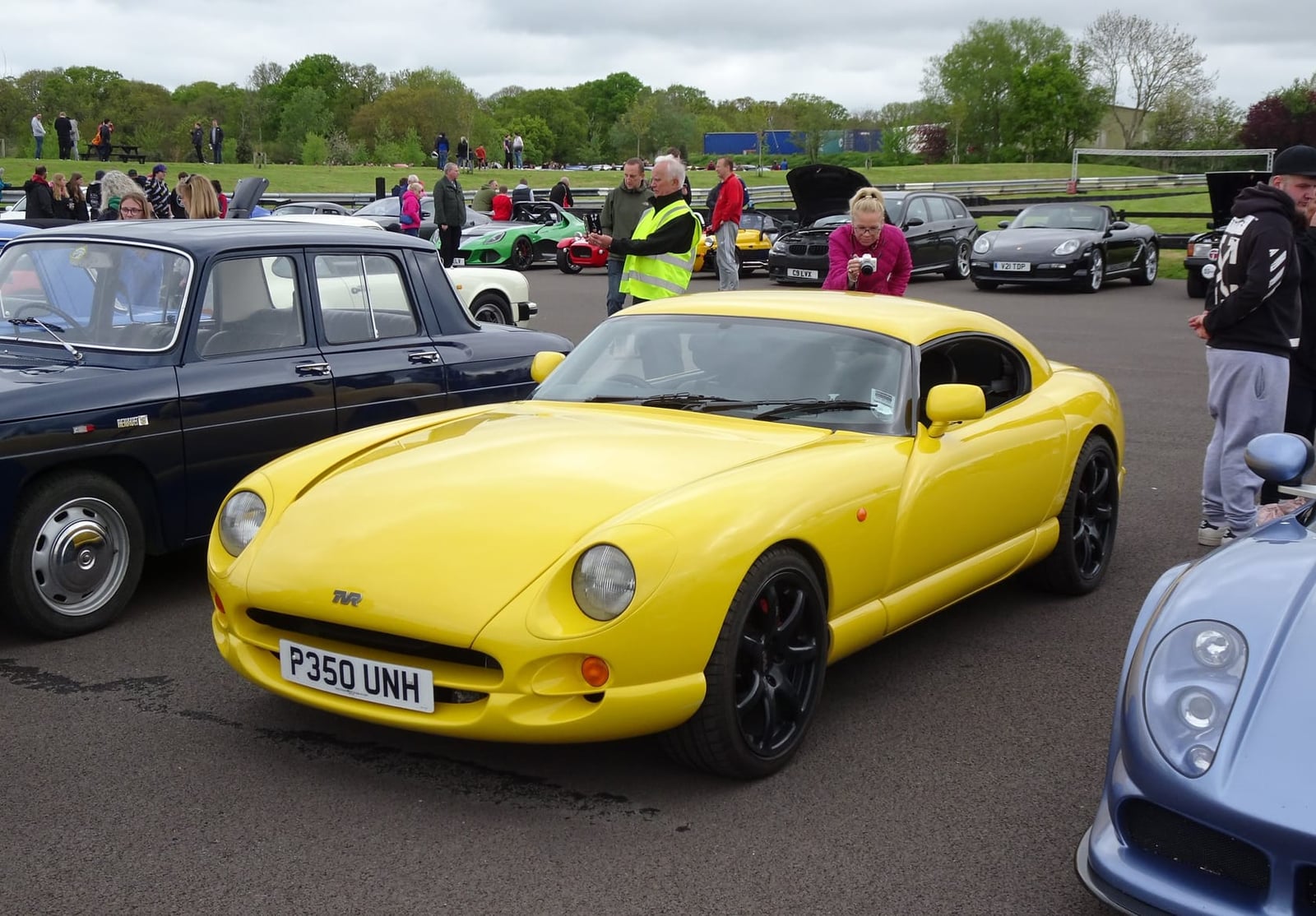 A yellow TVR Cerbera with UK registration P350 UNH at an outdoor show